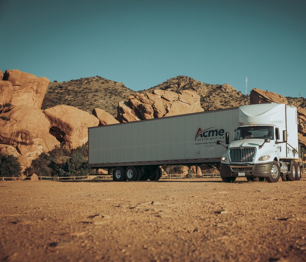 Denver trucking company FTL freight transport semi-truck on highway delivering full truckload cargo