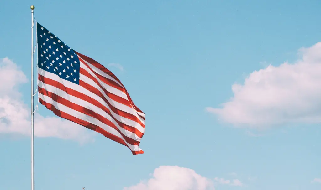 Flag outside of ACME Distribution’s Colorado warehouse, representing service, teamwork, and leadership.